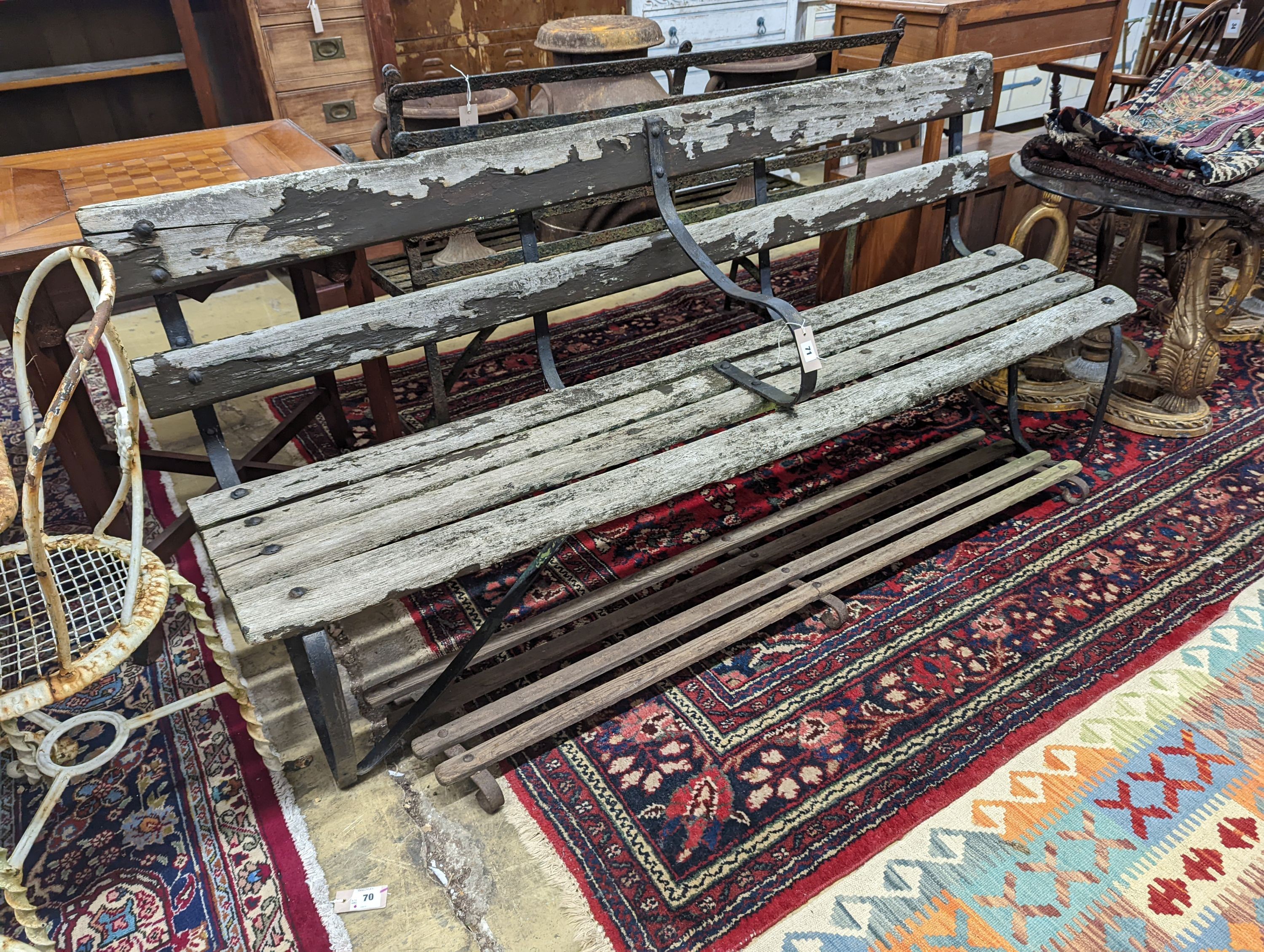 A 19th century wrought iron slatted garden bench with footrest, bench length 182cm, depth 45cm, height 85cm
